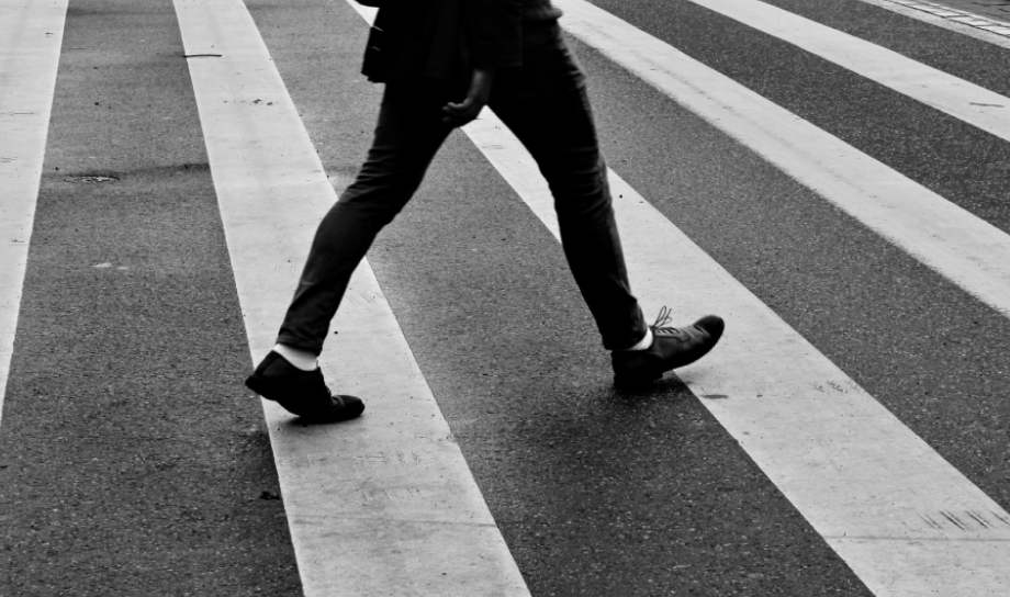 pedestrian walking down street